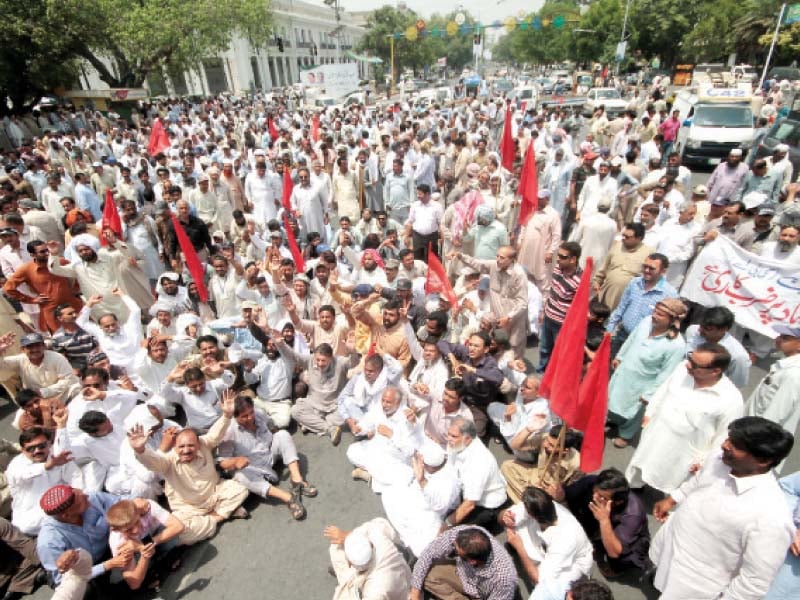 wapda workers staging a sit in on the mall photo abid nawaz express