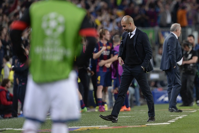 bayern munich 039 s spanish head coach pep guardiola looks down during the uefa champions league football match fc barcelona vs fc bayern muenchen at the camp nou stadium in barcelona on may 6 2015 photo afp
