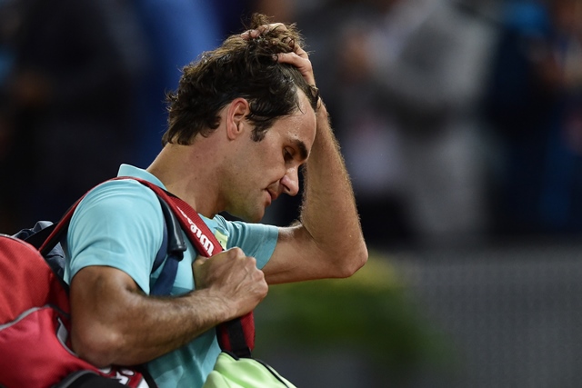 swiss tennis player roger federer reacts after loosing against australian tennis player nick kyrgios during the madrid open tournament at the caja magica magic box sports complex in madrid on may 6 2015 kyrgios won 6 7 2 7 7 6 7 5 7 6 14 12 photo afp