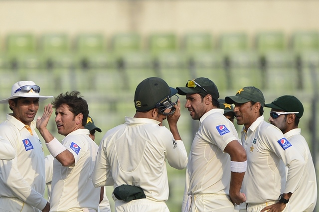 pakistan cricketer yasir shah 2l celebrates with his teammates after the dismissal of the bangladesh cricketer imrul kayes during the second day of the second cricket test match between bangladesh and pakistan at the sher e bangla national cricket stadium in dhaka on may 7 2015 photo afp