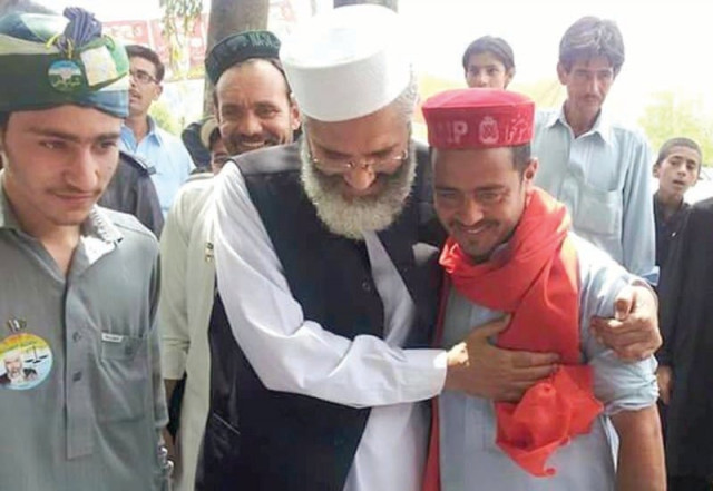 ji ameer sirajul haq welcomes an anp supporter as he comes in to cast his vote photo inp ji ameer sirajul haq welcomes an anp supporter as he comes in to cast his vote photo inp