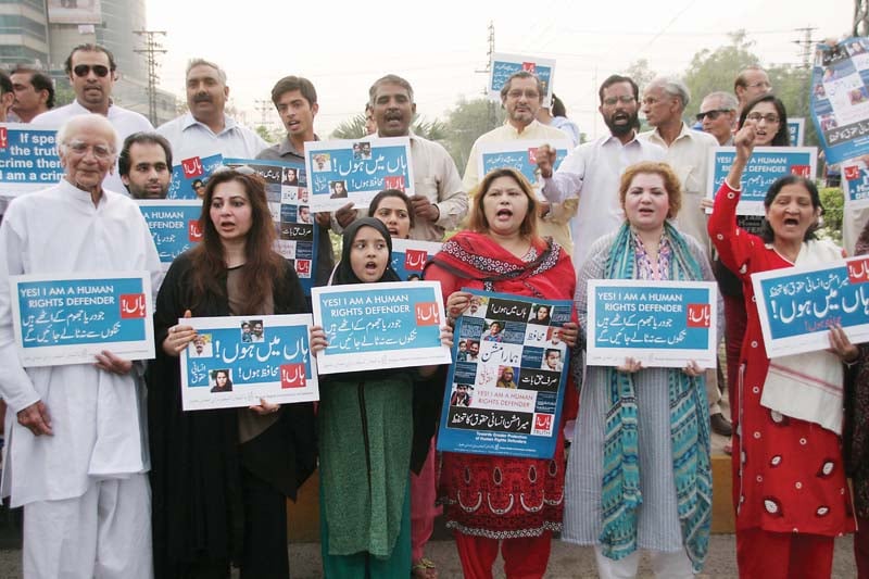 participants of the demonstration at liberty roundabout holding placards photo abid nawaz express