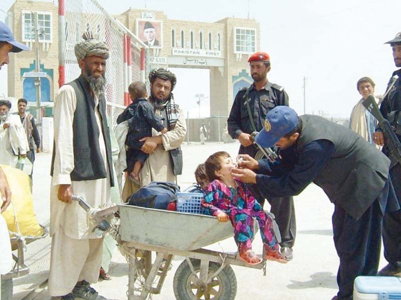 a child gets polio vaccine on pak afghan border at chaman photo file