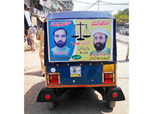 posters of lg candidates appear on the back of a rickshaw in the provincial capital photo sohail khattak express posters of lg candidates appear on the back of a rickshaw in the provincial capital photo sohail khattak express