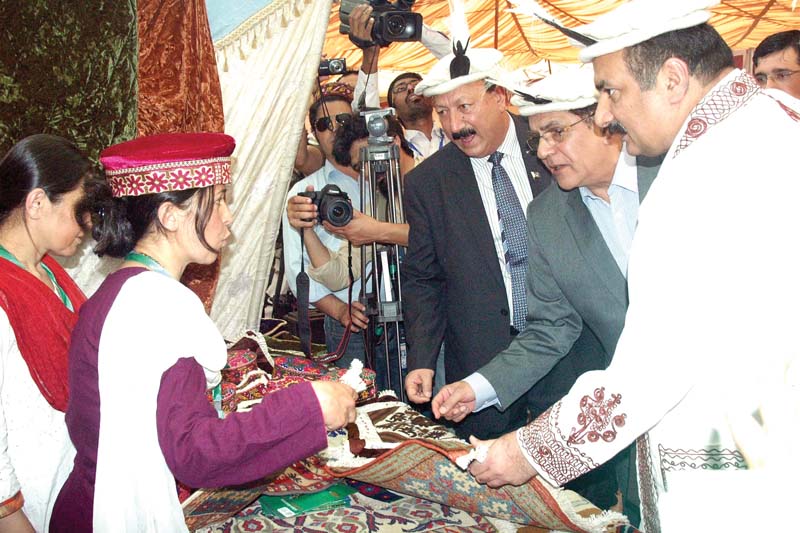 minister rana mashhood visits a handicrafts stall at the exhibition photo shafiq malik express