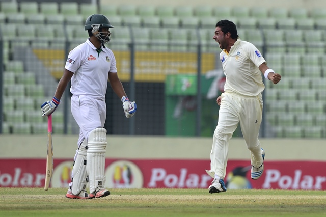 pakistan cricketer imran khan r reacts after the dismissal of the bangladesh cricketer tamim iqbal l during the fourth day of the second cricket test match between bangladesh and pakistan at the sher e bangla national cricket stadium in dhaka on may 9 2015 photo afp