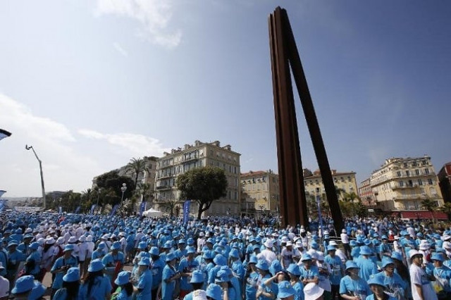 employees of chinese company tiens attend a parade on may 8 2015 in nice france organized by the company 039 s ceo li jinyuan photo afp employees of chinese company tiens attend a parade on may 8 2015 in nice france organized by the company 039 s ceo li jinyuan photo afp