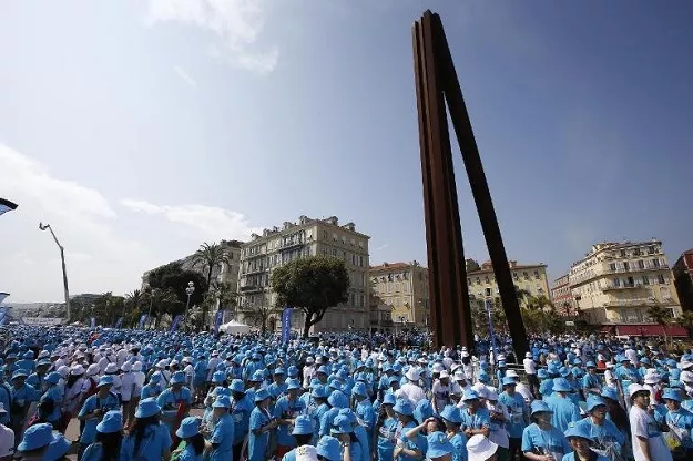 employees of chinese company tiens attend a parade on may 8 2015 in nice france organized by the company 039 s ceo li jinyuan photo afp employees of chinese company tiens attend a parade on may 8 2015 in nice france organized by the company 039 s ceo li jinyuan photo afp