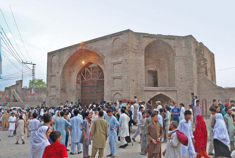 people gather outside the closed gates of gor gathri photos muhammad iqbal express