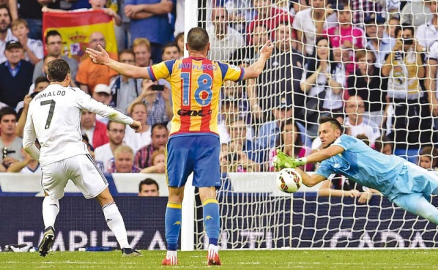 diego alves stops a penalty from cristiano ronaldo on the brink of half time ensuring the visitors kept their 2 0 lead at the break photo afp diego alves stops a penalty from cristiano ronaldo on the brink of half time ensuring the visitors kept their 2 0 lead at the break photo afp