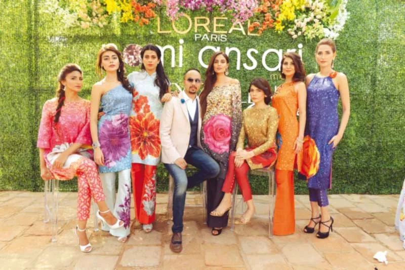 nomi strikes a pose with models sporting bespoke designs for the campaign photo publicity nomi strikes a pose with models sporting bespoke designs for the campaign photo publicity