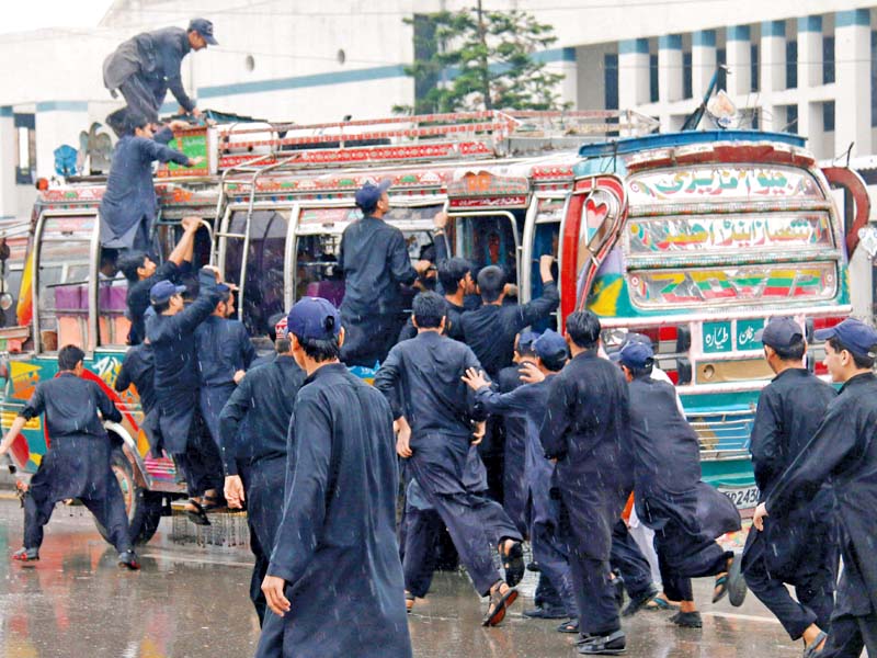 schoolboys run to catch a bus on sher shah suri road photo muhammad iqbal express