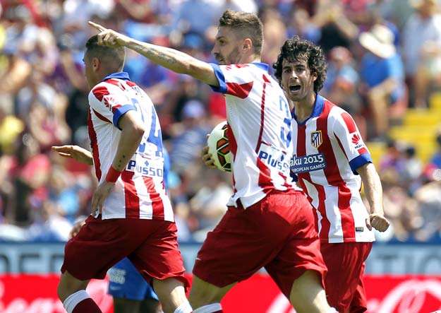 atletico madrid 039 s brazilian defender guilherme siqueira c celebrates with teammates after scoring a goal during the spanish league football match levante ud vs club atletico de madrid at the ciutat de valencia stadium in valencia on may 10 2015 photo afp