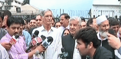 k p supporters conduct sit in outside parliament house