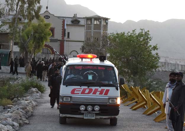 an ambulance believed to be transporting the body of saulat mirza leaves the mach jail following his executionon may 12 2015 photo afp