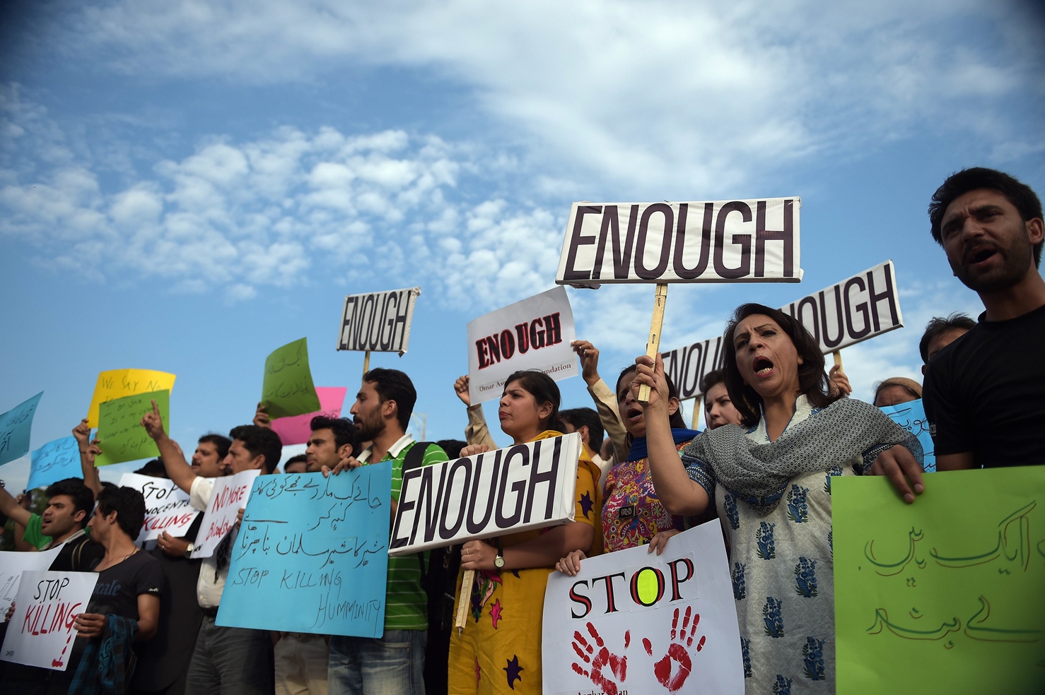 pakistani civil society activists shout slogans during a protest against the killing of the shiite ismaili minority by gunmen in karachi on may 13 2015 photo afp