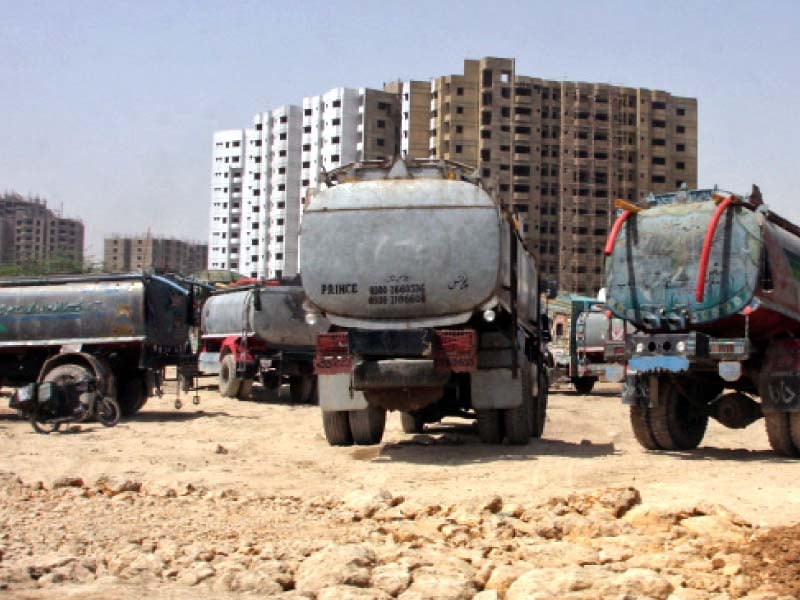 water tankers stand parked near safoora goth with karachi s water woes much of the city is dependent upon tanker services for water photo file