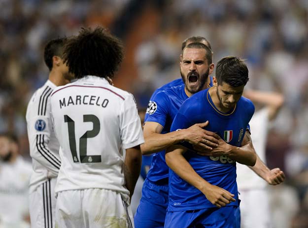 real madrid 039 s brazilian defender marcelo l watches juventus 039 spanish forward alvaro morata r celebrate after scoring during the uefa champions league semifinal second leg football match real madrid fc vs juventus at the santiago bernabeu stadium in madrid on may 13 2015 photo afp