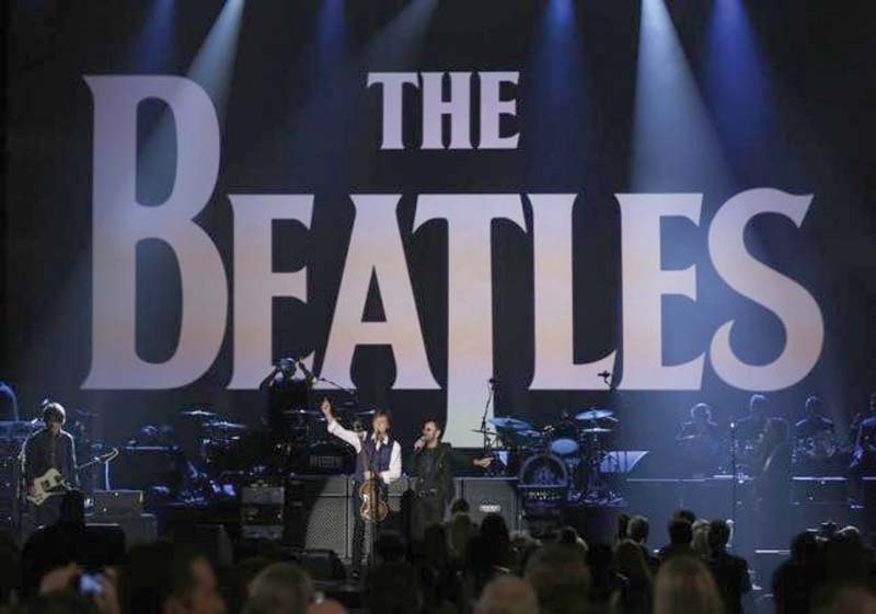 paul mccartney l and ringo starr perform during the taping of the night that changed america a grammy salute to the beatles photos reuters file