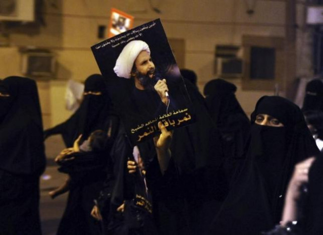 a protester holds up a picture of sheikh nimr al nimr during a rally in qatif riyadh against sheikh nimr 039 s arrest on july 8 2012 photo reuters a protester holds up a picture of sheikh nimr al nimr during a rally in qatif riyadh against sheikh nimr 039 s arrest on july 8 2012 photo reuters