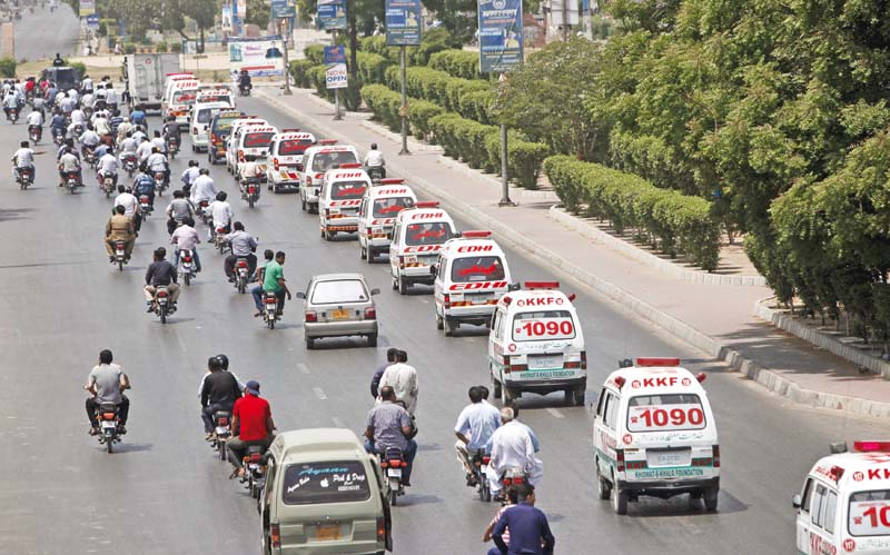 ambulances transport the bodies to the graveyard on thursday photo online