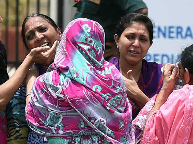 sindh assembly passes resolution in the aftermath of the attack top police officials visit safora carnage site photo afp