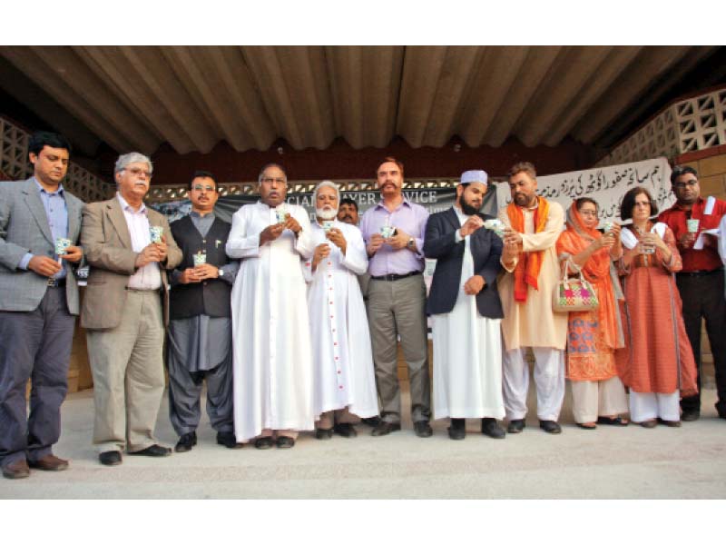 a large number of people including religious scholars politicians and civil society activists gathered at st patrick s cathedral to hold special prayers in remembrance of the 45 ismaili men and women targeted on wednesday photo athar khan express