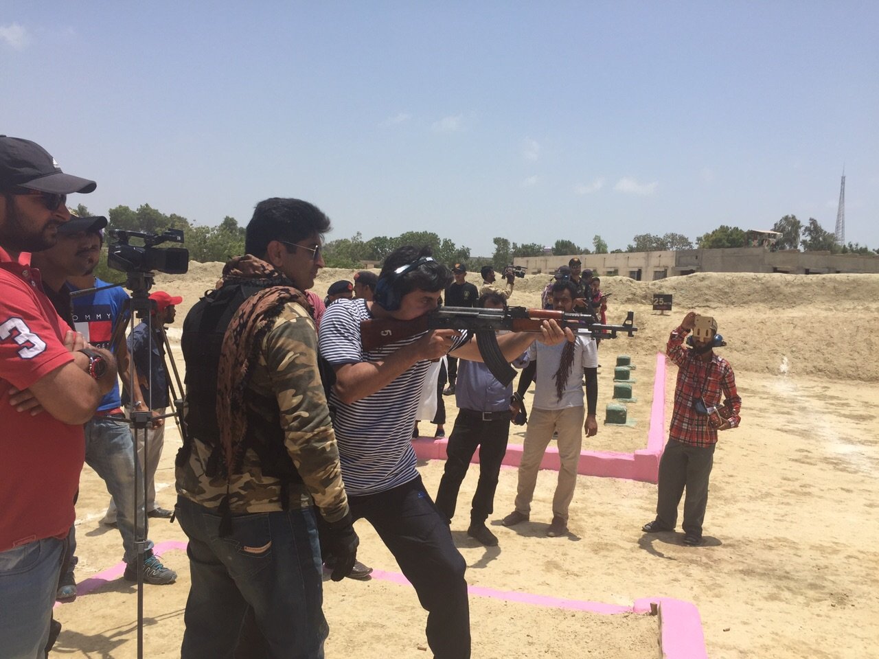 journalists fire an ak 47 during weapons training at the police training centre in razzaqabad photo rabia ali express