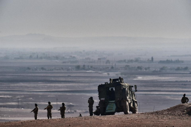 turkish soldiers stand guard in the turkish border village of mursitpinar sanliurfa province on november 10 2014 photo afp turkish soldiers stand guard in the turkish border village of mursitpinar sanliurfa province on november 10 2014 photo afp