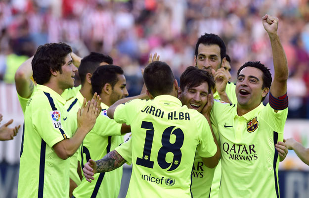 barcelona 039 s defender jordi alba r barcelona 039 s argentinian forward lionel messi c and barcelona 039 s players celebrate winning the 2015 spanish liga championship after they won the spanish league football match club atletico de madrid vs fc barcelona at the vicente calderon stadium in madrid on may 17 2015 photo afp