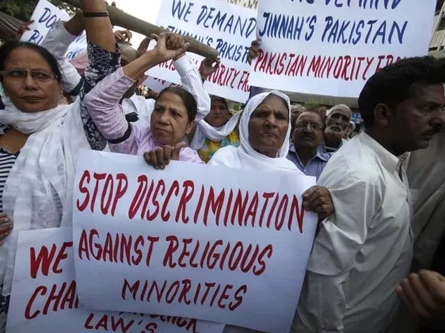 protesters hold up placards at a rally in karachi photo reuters protesters hold up placards at a rally in karachi photo reuters