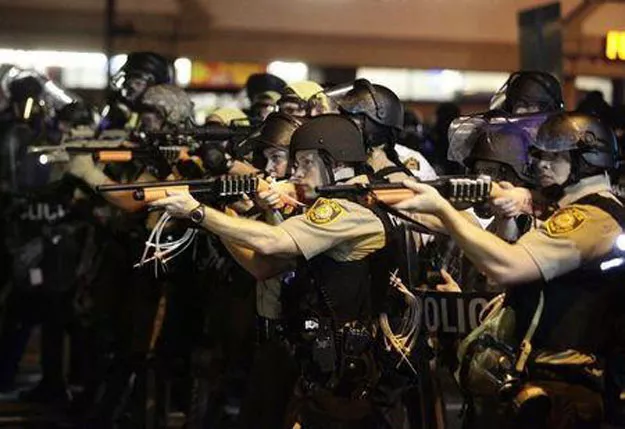 police officers point their weapons at demonstrators protesting against the shooting death of michael brown in ferguson missouri august 18 2014 photo reuters police officers point their weapons at demonstrators protesting against the shooting death of michael brown in ferguson missouri august 18 2014 photo reuters
