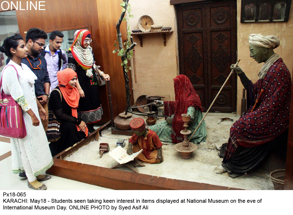 students seen taking keen interest in items displayed at national museum on the eve of international museum day in karachi photo online