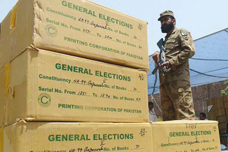 a soldier guards the election material ahead of 2013 polls photo file a soldier guards the election material ahead of 2013 polls photo file