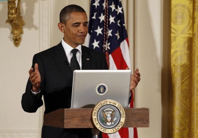 us president barack obama reacts after tweeting at his first ever twitter town hall in the east room at the white house in washington july 6 2011 photo reuters