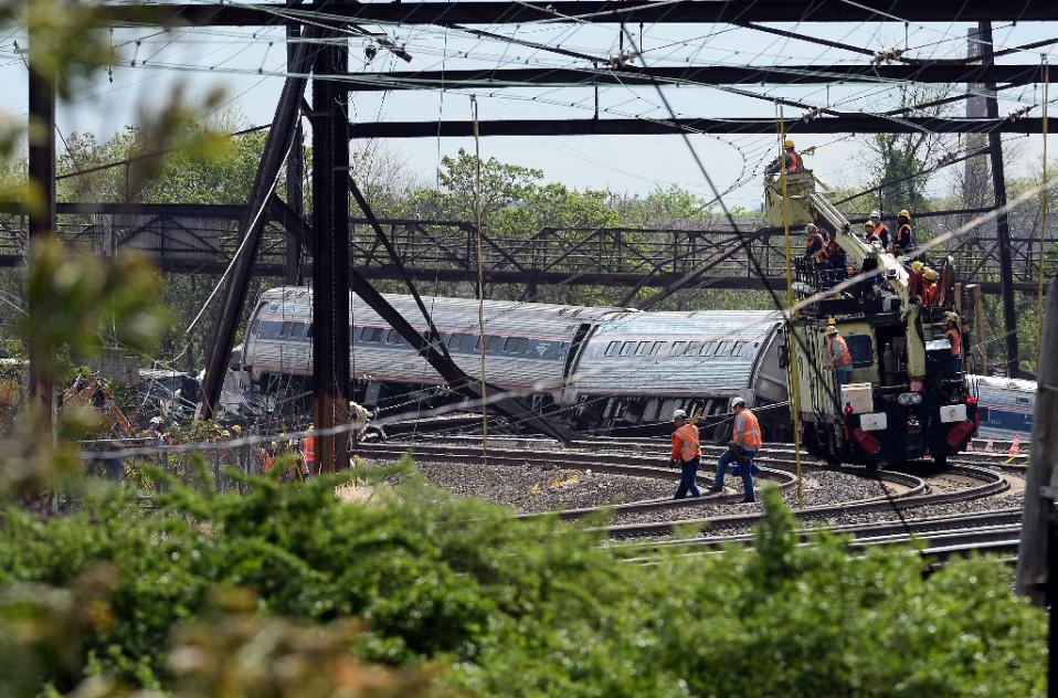 rescuers work around derailed cars of an amtrak train in philadelphia pennsylvania on may 13 2015 photo afp