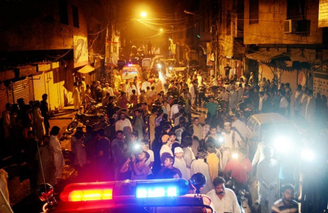people gathered outside a house after a fire apparently triggered by a short circuit claimed the lives of six children in lahore photo online people gathered outside a house after a fire apparently triggered by a short circuit claimed the lives of six children in lahore photo online
