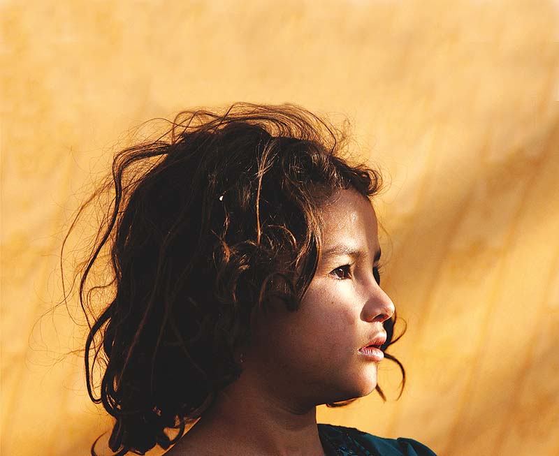 hamida a six year old who fled a military offensive in the swat valley region sits outside a food distribution tent photo reuters