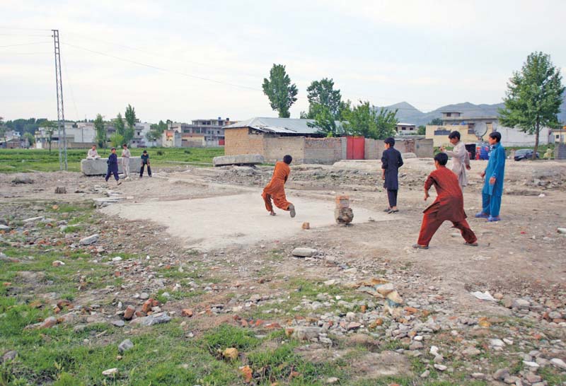 this file photo shows children playing cricket near the site of the demolished compound of slain al qaeda leader osama bin laden in abbottabad photo afp