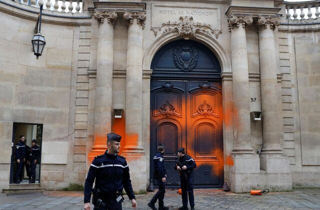 french activists spray paint the frence pm office photo reuters