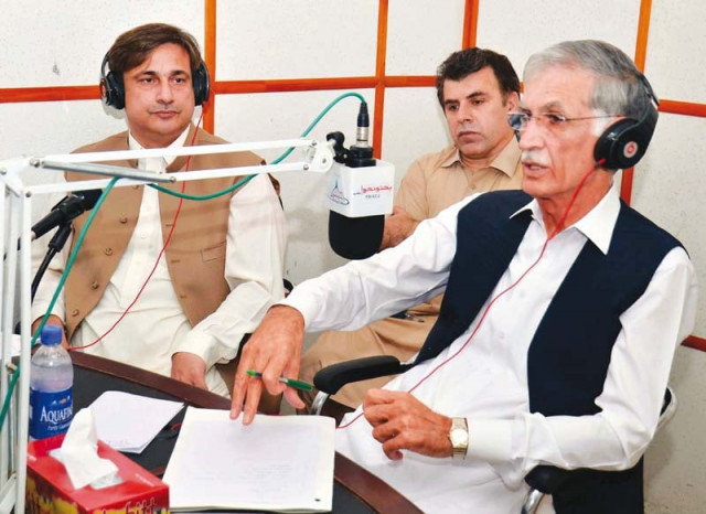 cm khattak takes live calls during the show photo express cm khattak takes live calls during the show photo express