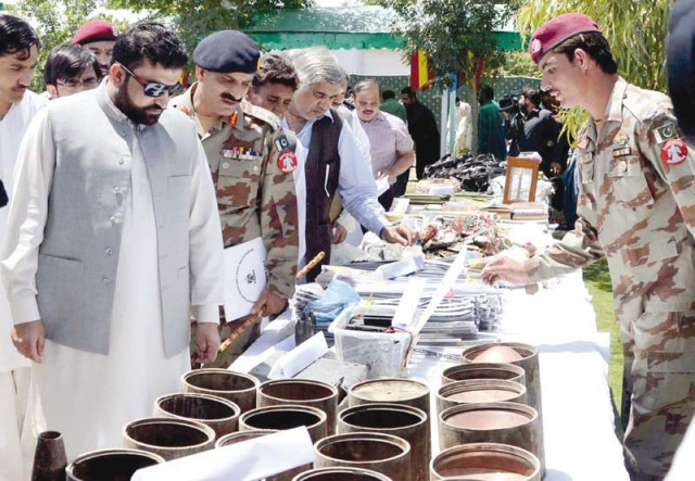 balochistan home minister sarfaraz bugti and fc dig brigadier tahir inspecting explosives seized from different parts of the province photo inp balochistan home minister sarfaraz bugti and fc dig brigadier tahir inspecting explosives seized from different parts of the province photo inp