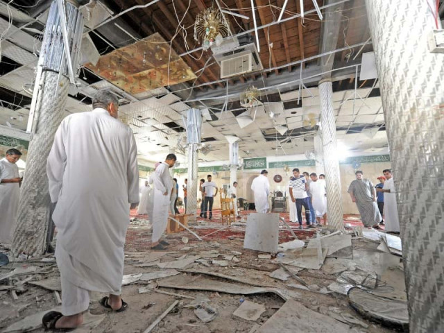 people gather after the blast inside a mosque in qatif photo afp