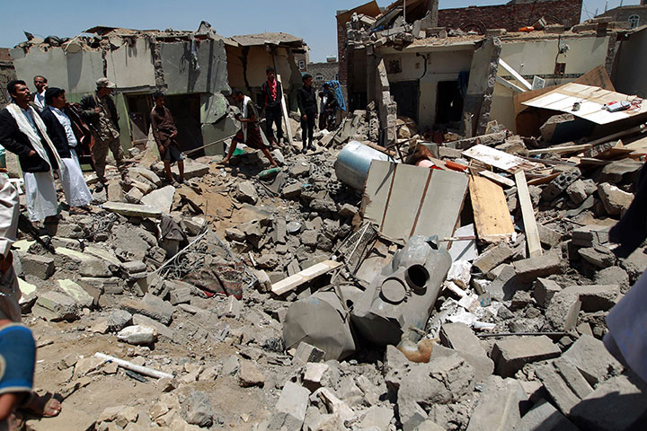 yemenis gather near the rubble of houses near sanaa airport on march 31 2015 which were destroyed by an air strike as saudi led coalition warplanes hit shia houthi militia targets across yemen overnight targeting the group 039 s northern stronghold of saadeh the capital sanaa and the central town of yarim residents and media said photo afp