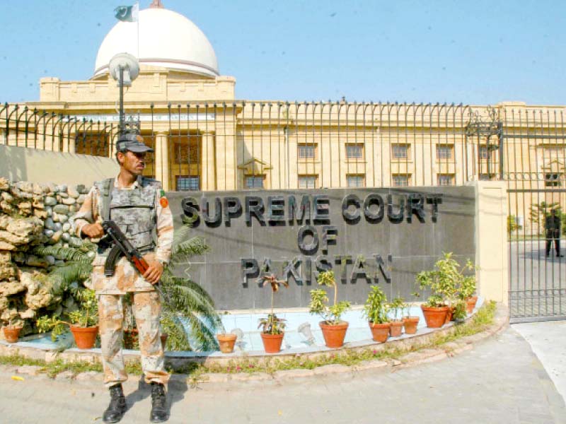 a rangers official stands on guard at the supreme court registry in karachi photo file