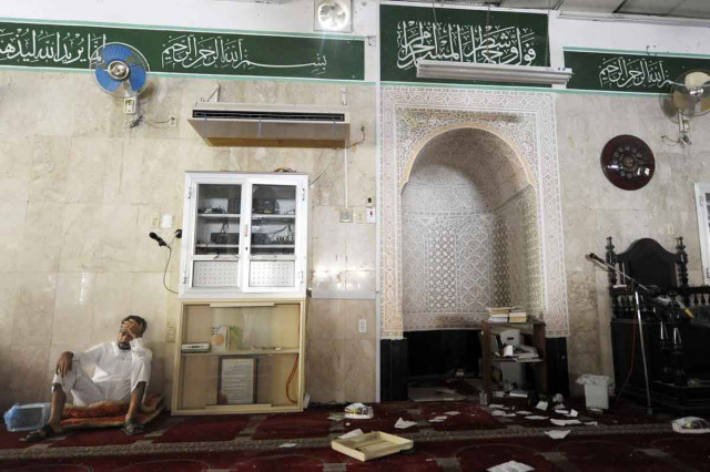 a saudi man reacts following a suicide blast inside a mosque in the saudi town of qatif 400 kms east of riyadh on may 22 2015 photo afp a saudi man reacts following a suicide blast inside a mosque in the saudi town of qatif 400 kms east of riyadh on may 22 2015 photo afp