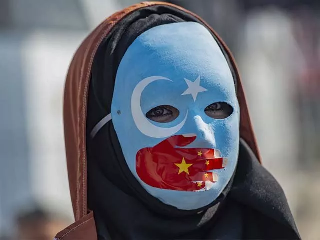 a demonstrator joins supporters of china 039 s muslim uighur minority and during a anti china protest photo getty a demonstrator joins supporters of china 039 s muslim uighur minority and during a anti china protest photo getty