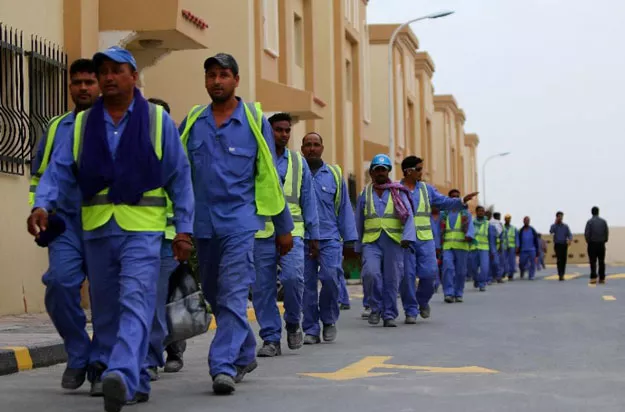 foreign labourers working on the construction site of the al wakrah football stadium walk back to their accomodation at the ezdan 40 compound after finishing work on may 4 2015 in doha photo afp foreign labourers working on the construction site of the al wakrah football stadium walk back to their accomodation at the ezdan 40 compound after finishing work on may 4 2015 in doha photo afp