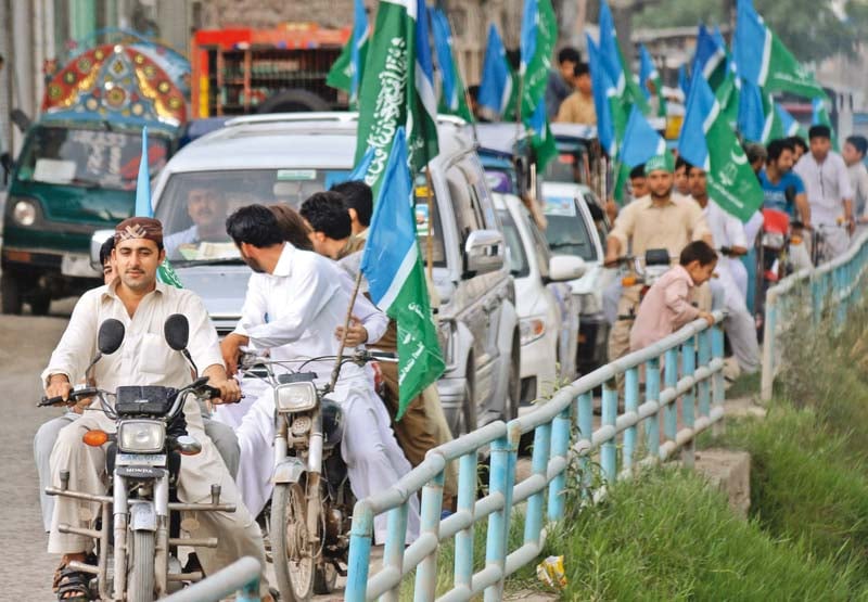 workers of jamaat e islami in a rally last week near rasheedabad chowk in town ii photo muhammad iqbal express