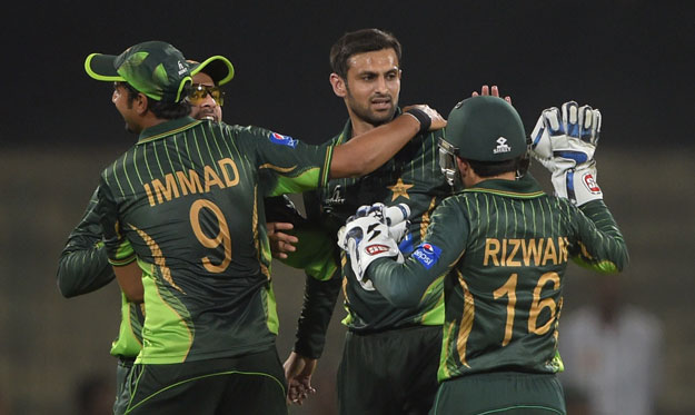 pakistani spinner shoaib malik 2r celebrates with teammates after taking the wicket of zimbabwe batsman hamilton masakadza during the second and final international t20 cricket match between pakistan and zimbabwe at the gaddafi cricket stadium in lahore on may 24 2015 photo afp